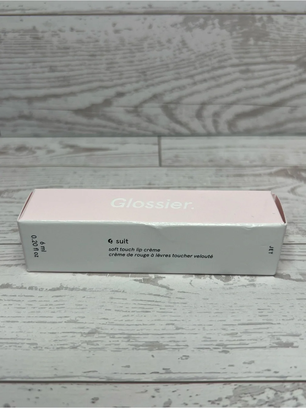 Glossier G suit, soft touch lip cream, shade JET
